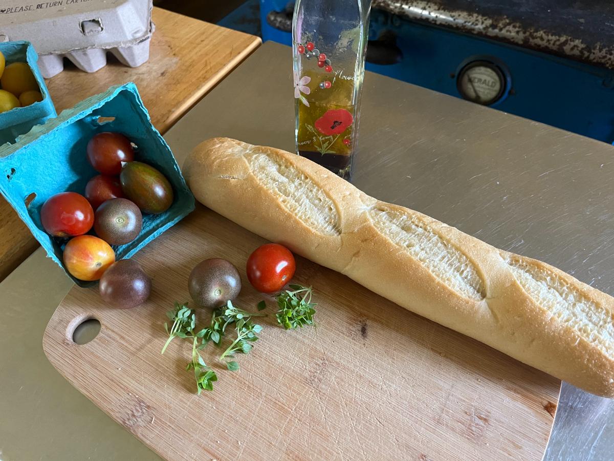 Fresh baguette and heirloom tomatoes with basil