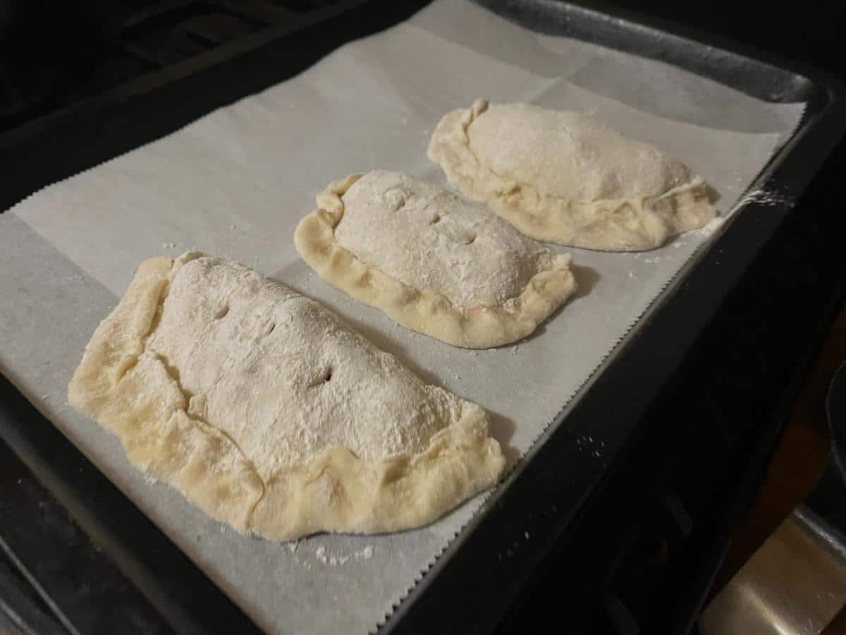 Raspberry turnovers on a parchment lined pan