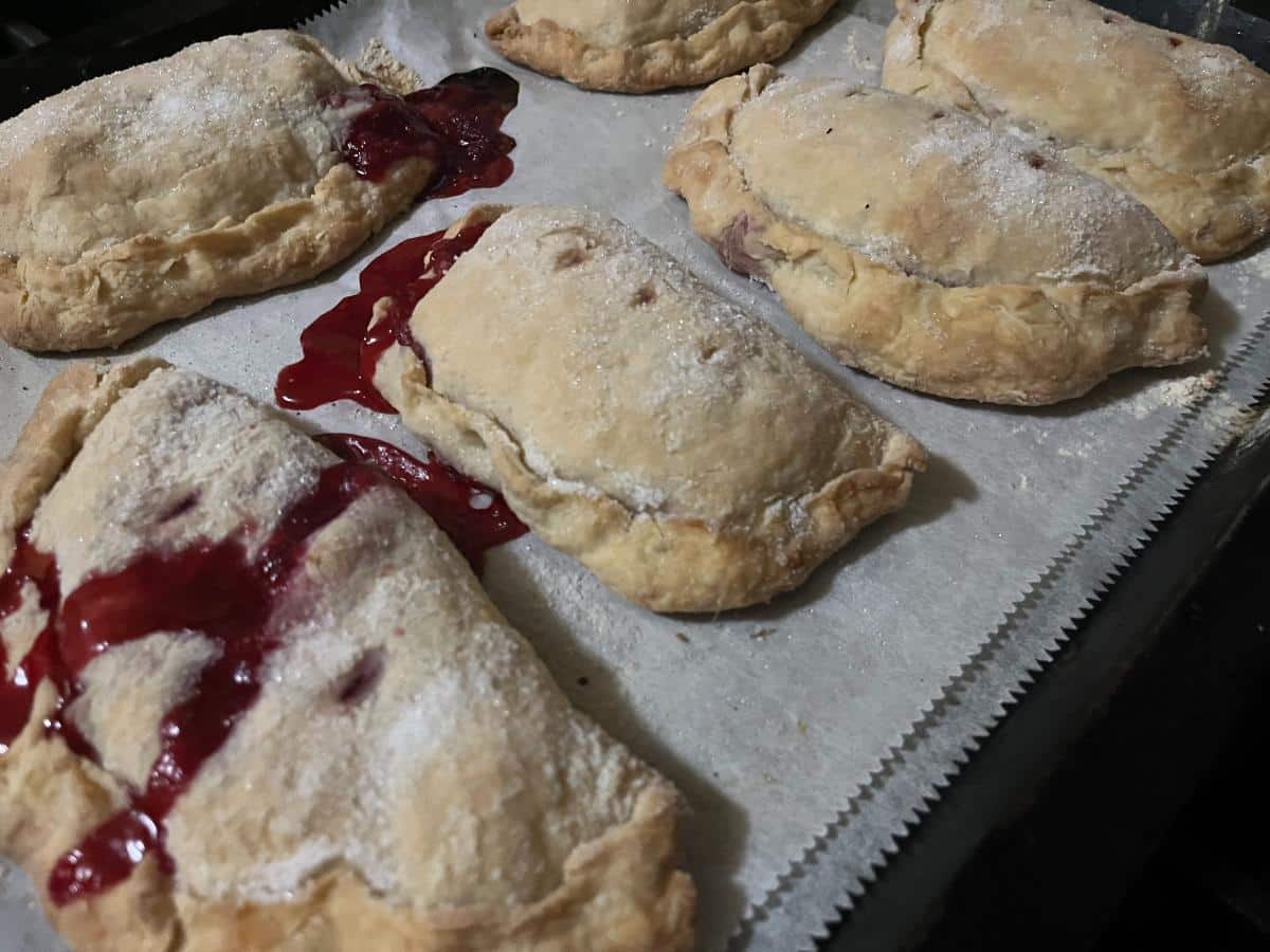 Freshly baked raspberry hand pies