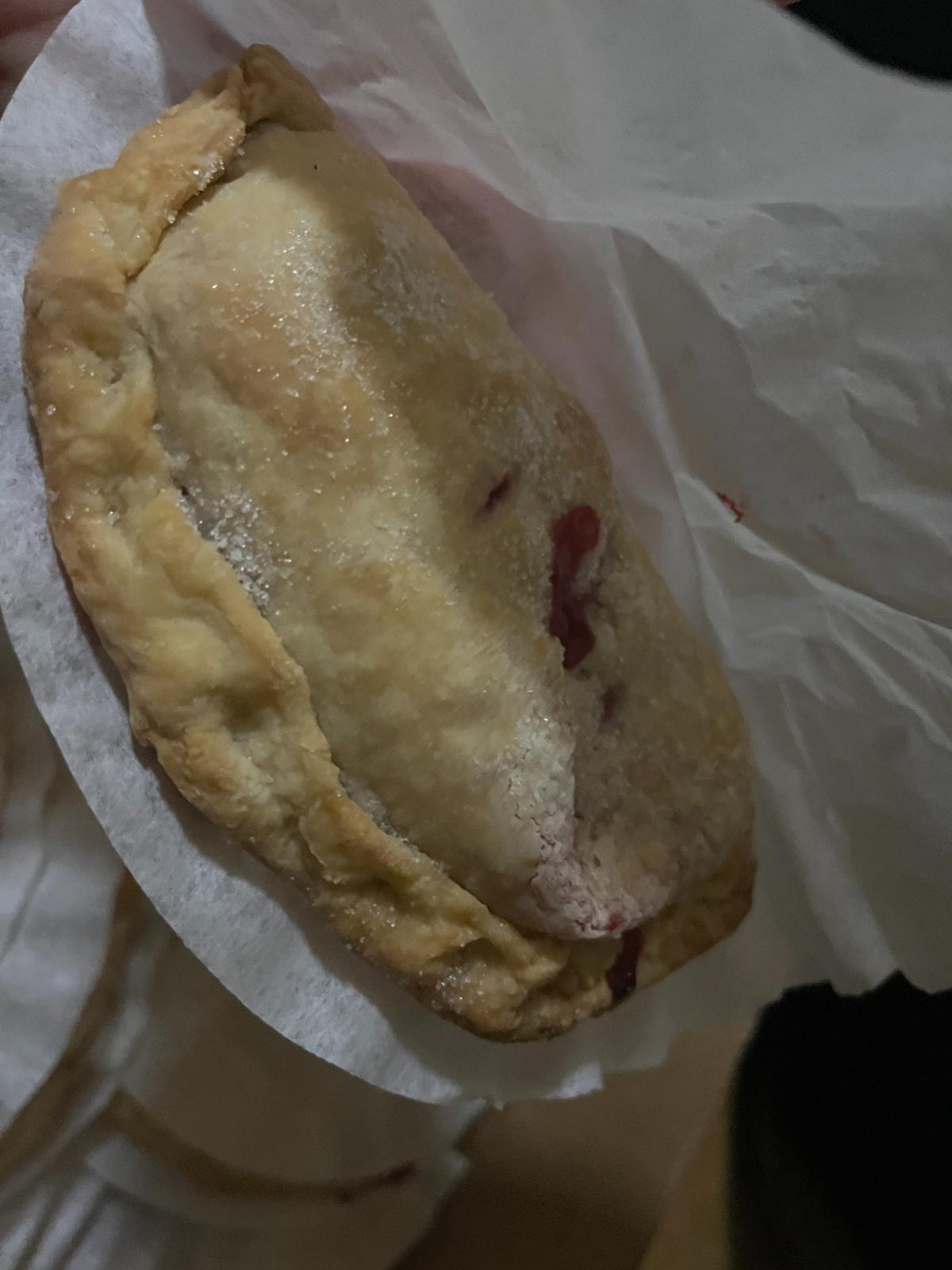 Fresh baked raspberry turnover hand pie