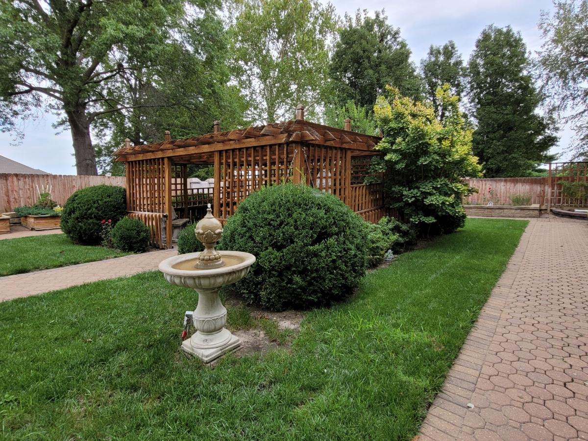 Garden statuary helping to age the landscape look