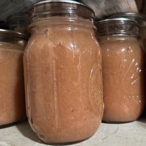 Jars full of homemade applesauce.