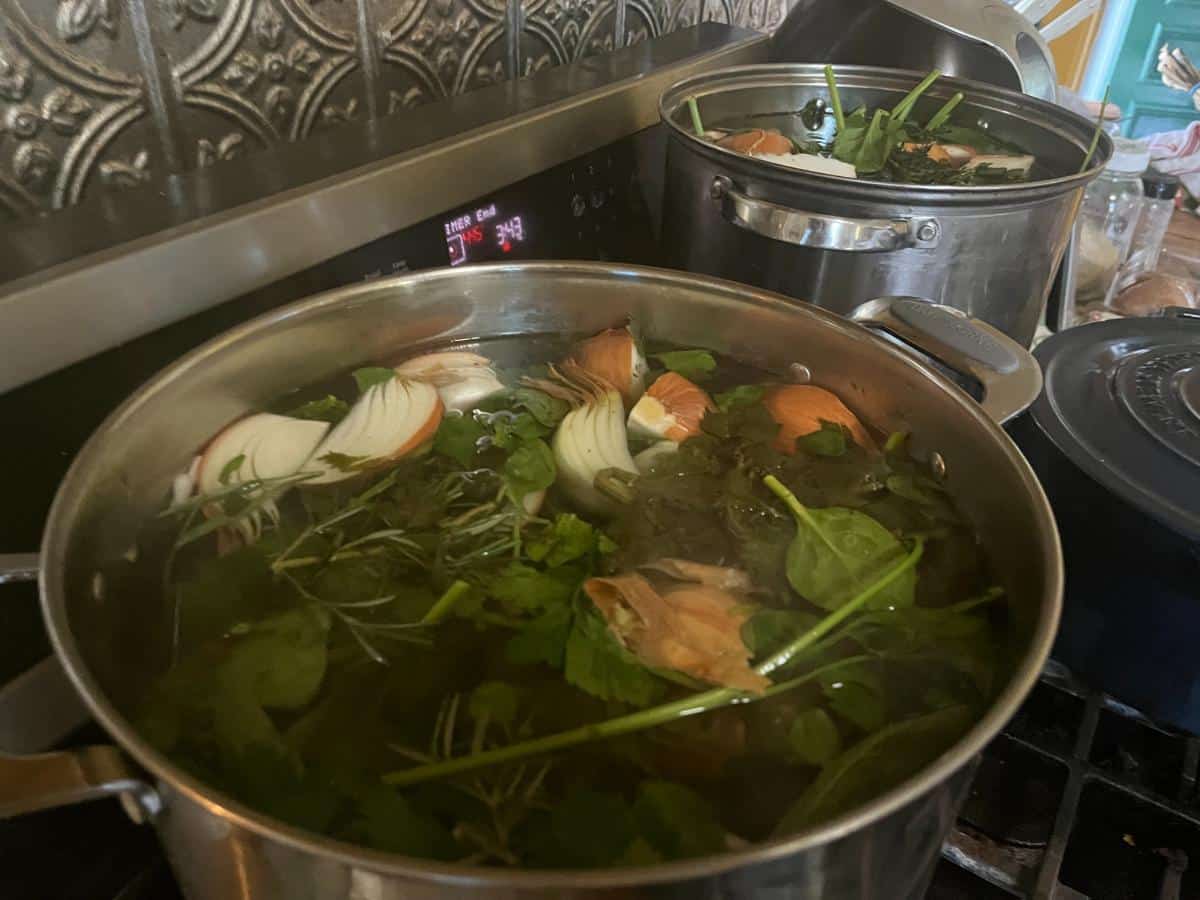 Simmering vegetables broth on the stove