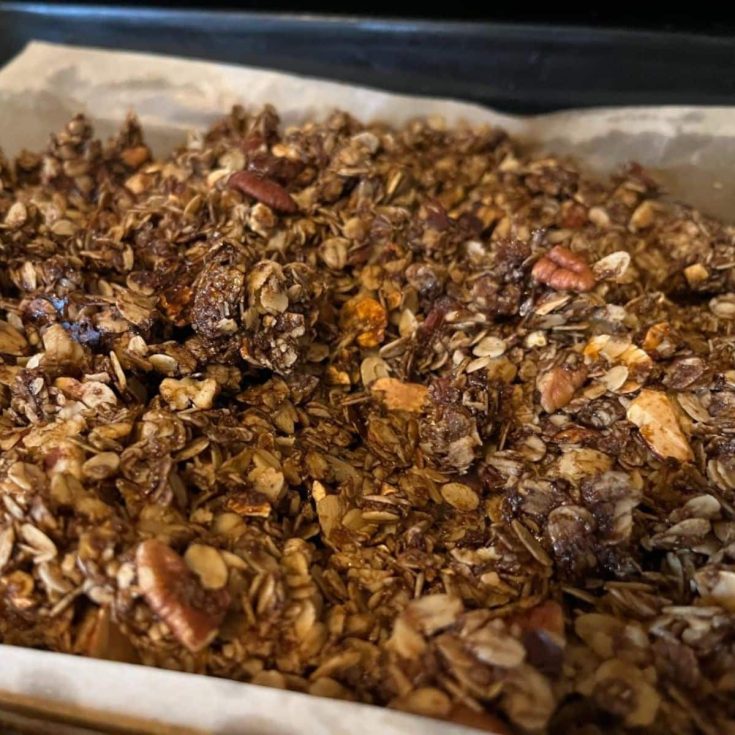 Delicious homemade granola on a baking tray.