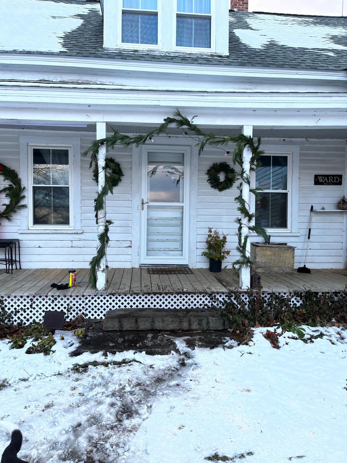 A porch decorated for Christmas