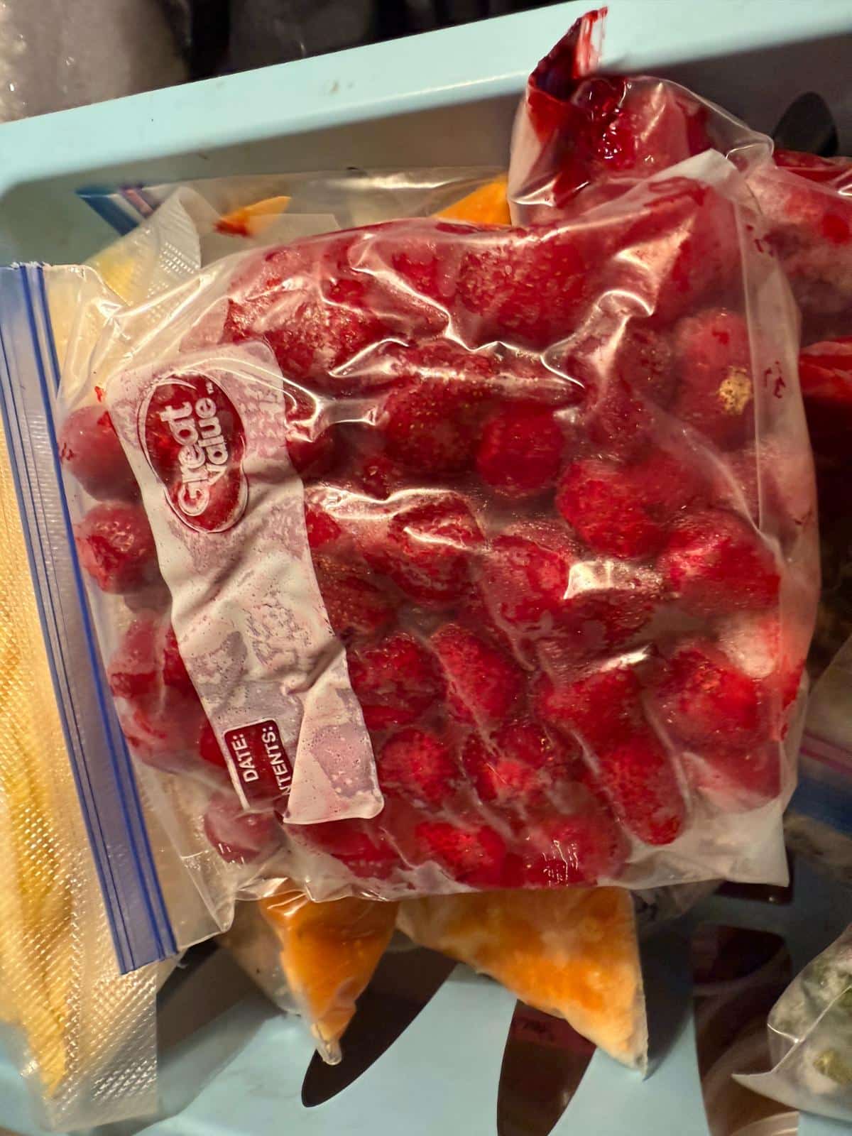 Strawberries in a freezer taking up space