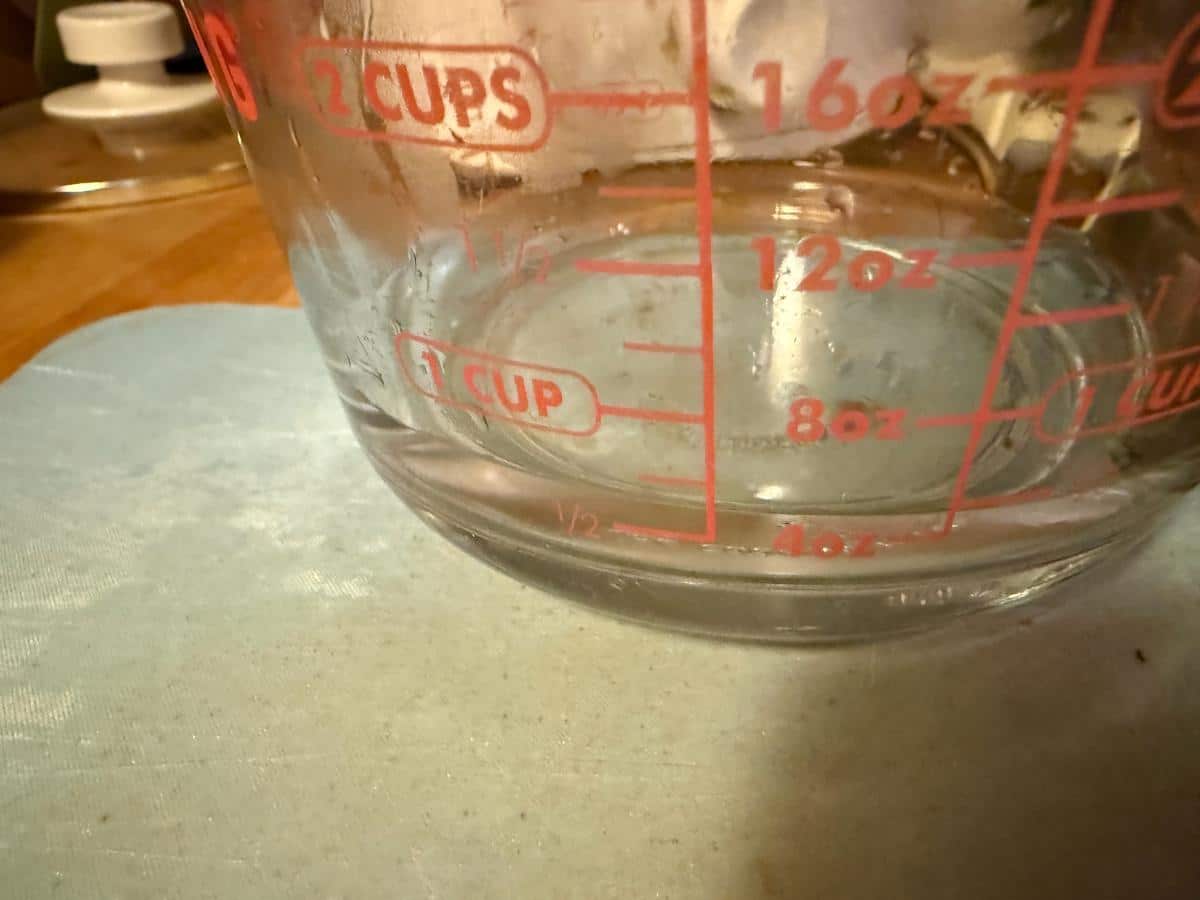 Water in a measuring cup for the recipe.