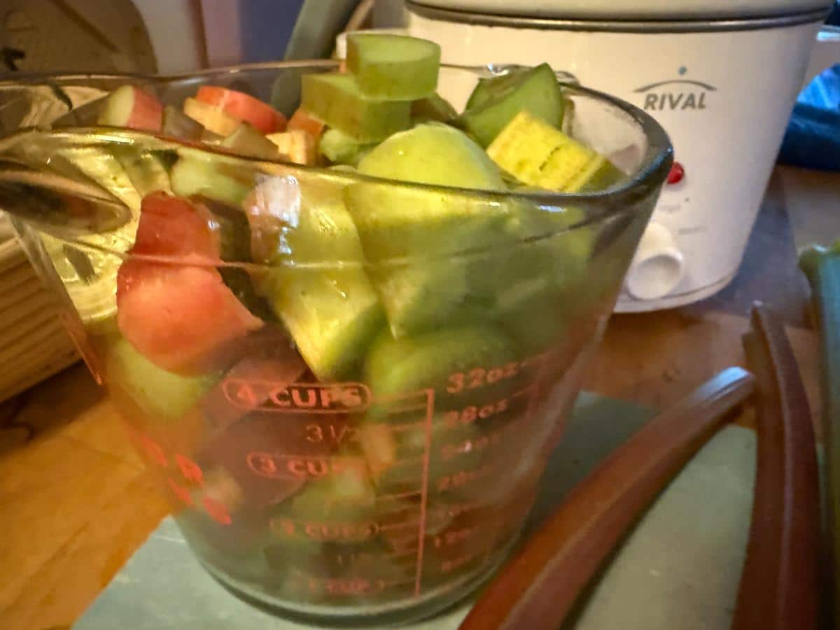 Cubed rhubarb in a measuring cup.