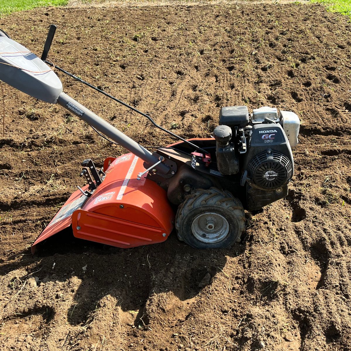 A freshly tilled ground with a rototiller.