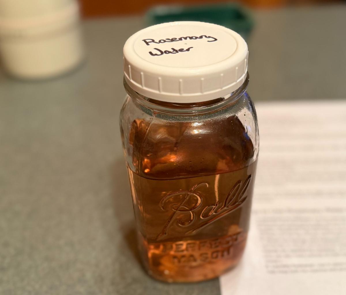 Rosemary water in a jar